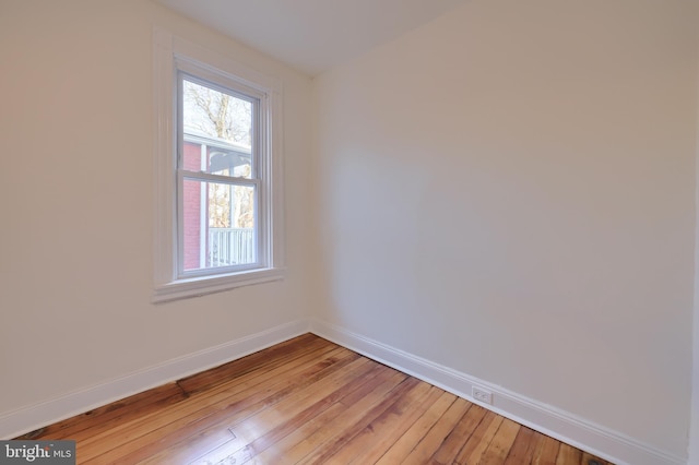 empty room with light hardwood / wood-style floors