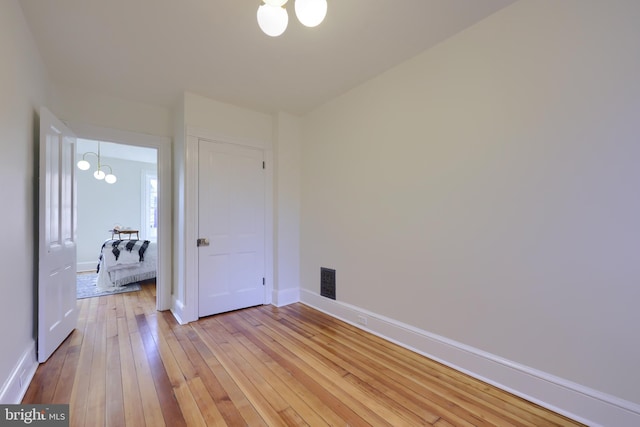 unfurnished bedroom with light hardwood / wood-style flooring