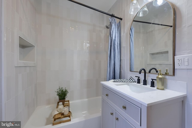 bathroom with vanity and shower / bath combo