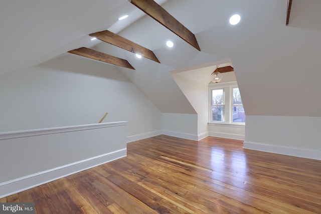 bonus room featuring vaulted ceiling with beams and hardwood / wood-style floors