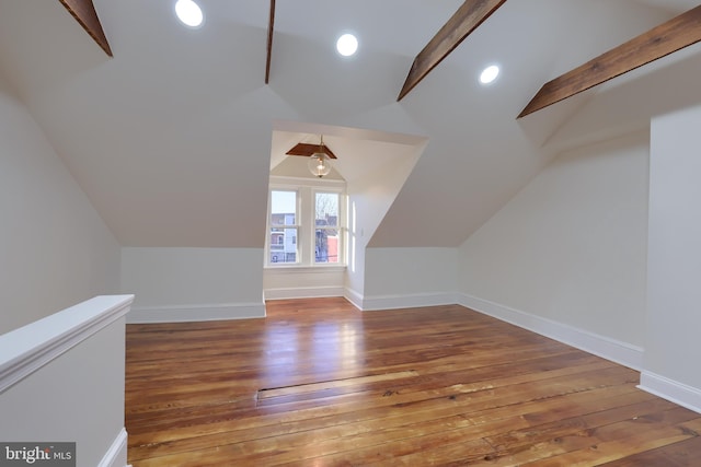 bonus room with lofted ceiling and hardwood / wood-style floors