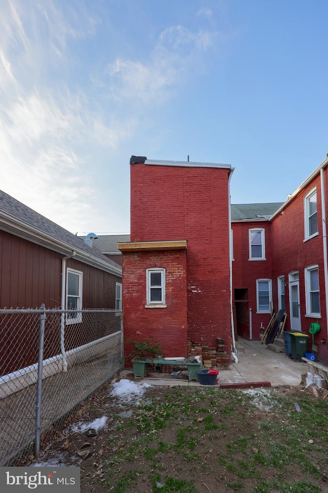 rear view of house with a patio