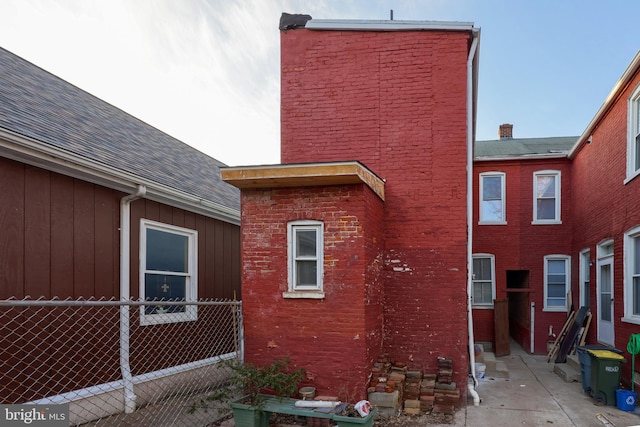 view of side of property featuring a patio