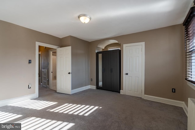 unfurnished bedroom featuring carpet floors