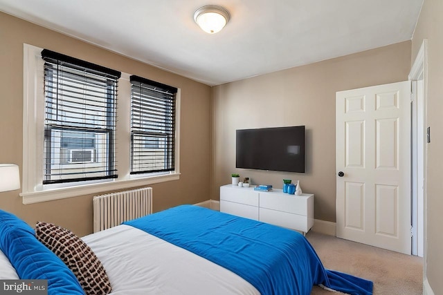 bedroom featuring radiator and carpet floors