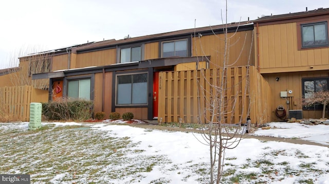 view of snowy exterior with central air condition unit