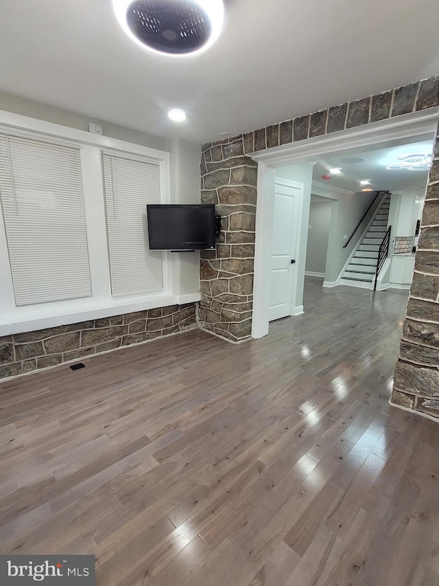 unfurnished living room featuring dark hardwood / wood-style floors