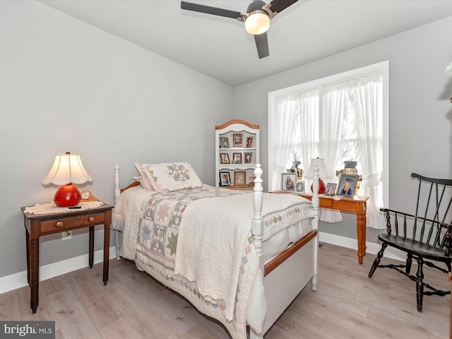 bedroom with ceiling fan and light hardwood / wood-style flooring