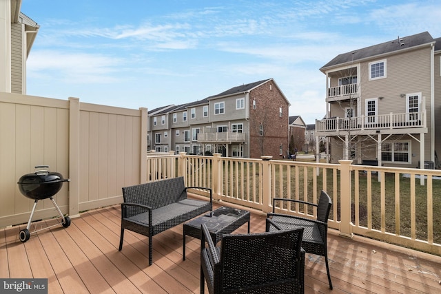 wooden deck featuring a yard