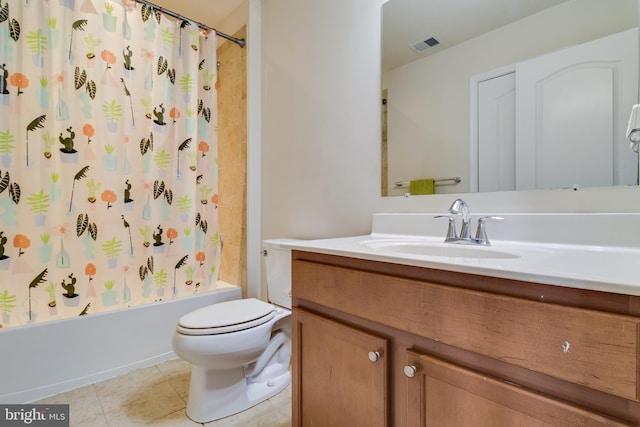 full bathroom featuring tile patterned floors, toilet, shower / bath combo with shower curtain, and vanity