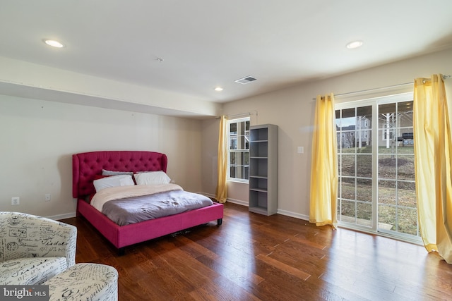 bedroom with dark hardwood / wood-style flooring and access to outside