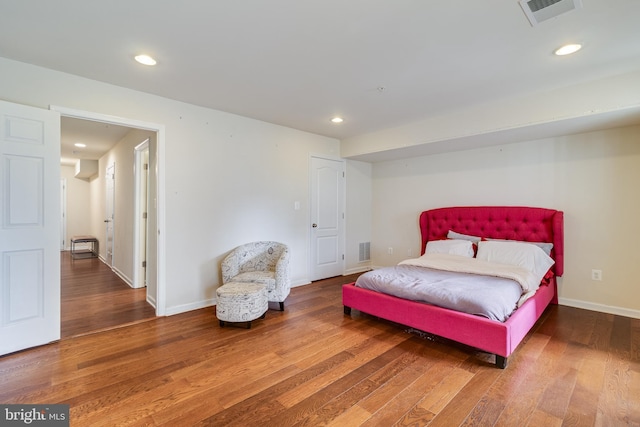 bedroom with wood-type flooring