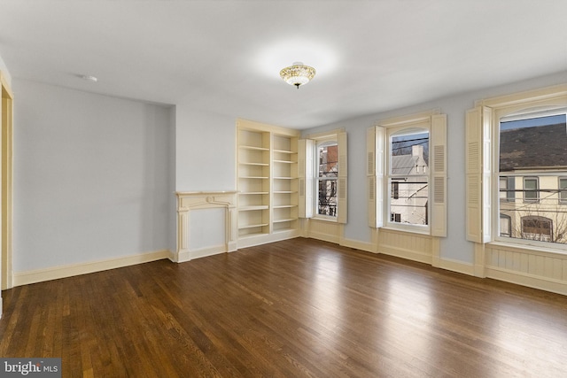 interior space featuring hardwood / wood-style flooring and built in features