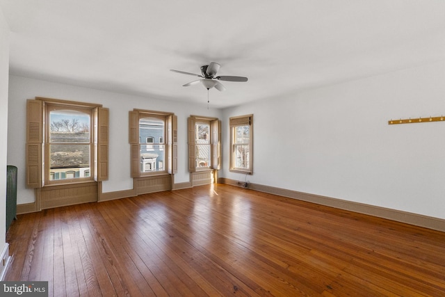 empty room featuring hardwood / wood-style flooring and ceiling fan