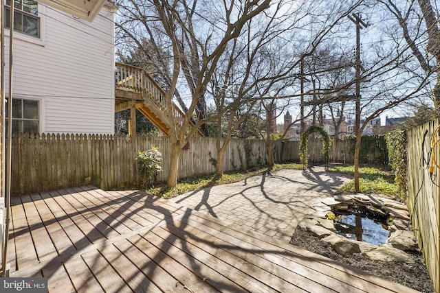 wooden deck with a patio