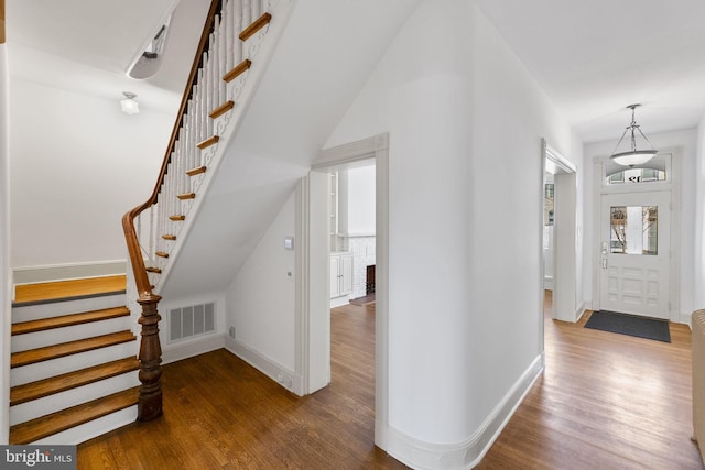 foyer with dark hardwood / wood-style flooring