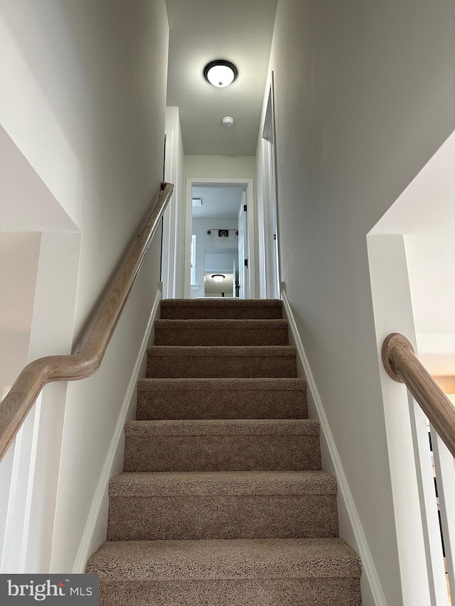 staircase with baseboards