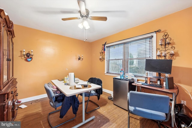 home office featuring ceiling fan and light wood-type flooring