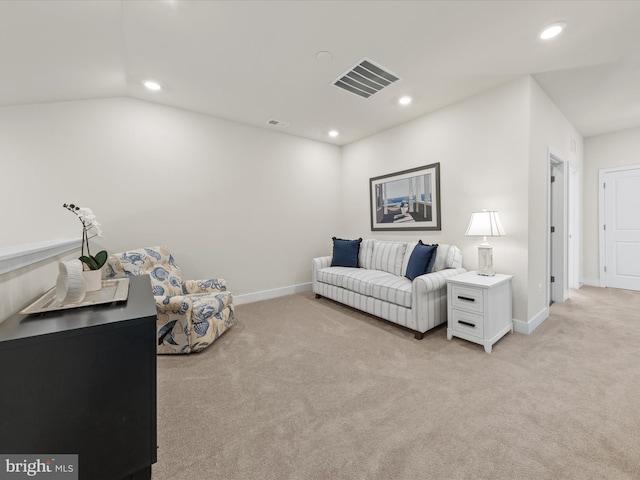 carpeted living room featuring lofted ceiling
