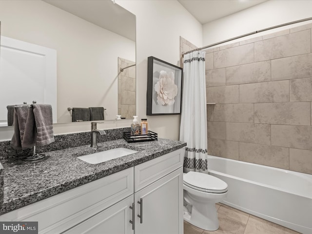 full bathroom featuring vanity, toilet, tile patterned flooring, and shower / bath combo with shower curtain