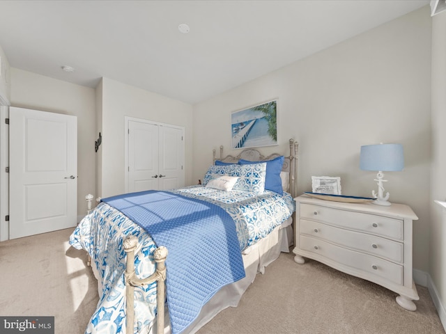 carpeted bedroom featuring a closet