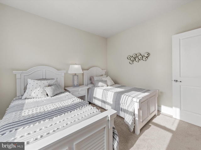 bedroom with light colored carpet