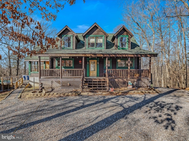 log-style house with a porch