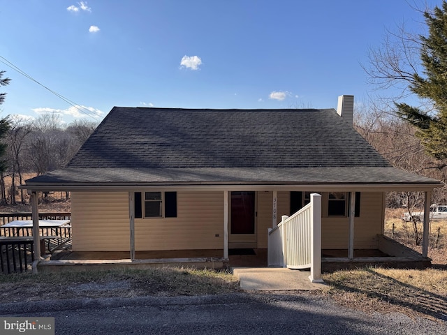 view of front of house with roof with shingles