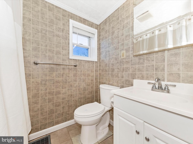 bathroom with tile patterned flooring, toilet, visible vents, tile walls, and crown molding