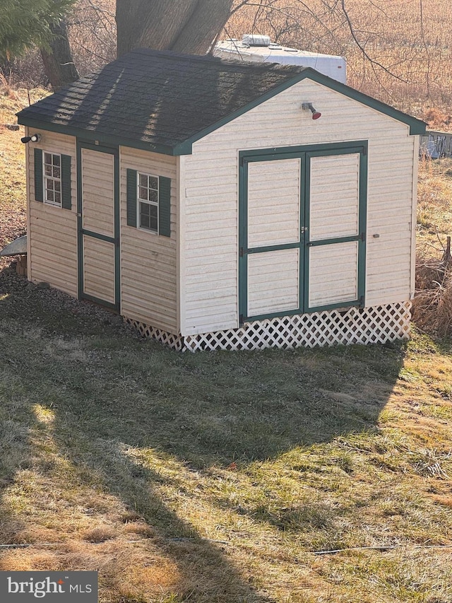 view of outdoor structure with a lawn