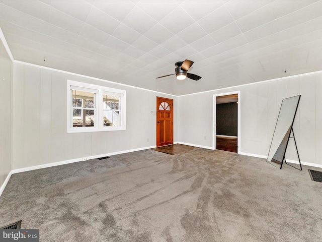 unfurnished living room with a ceiling fan, carpet, visible vents, and baseboards