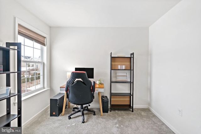 home office with baseboards and carpet floors