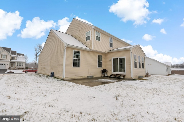 view of snow covered house