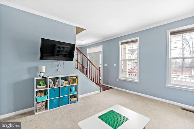 rec room with plenty of natural light, visible vents, and baseboards