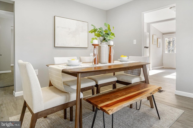 dining room with light hardwood / wood-style floors