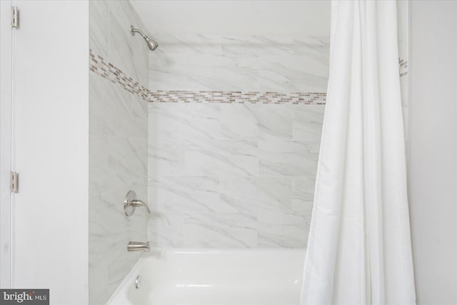 bathroom with shower / tub combo with curtain