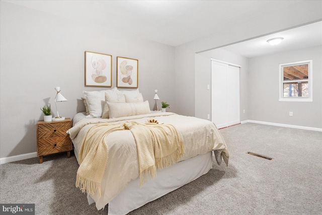 bedroom featuring carpet floors and a closet