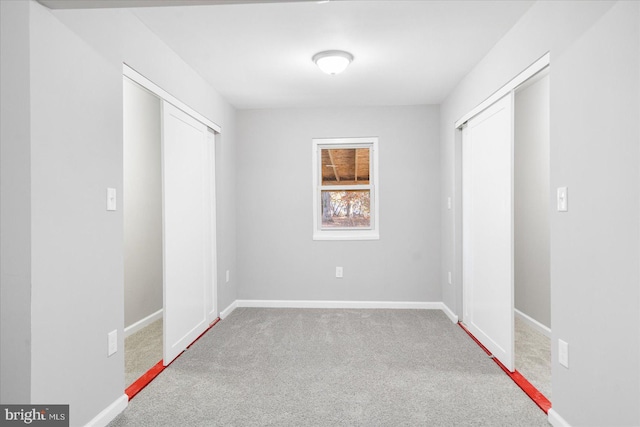 unfurnished bedroom with light carpet