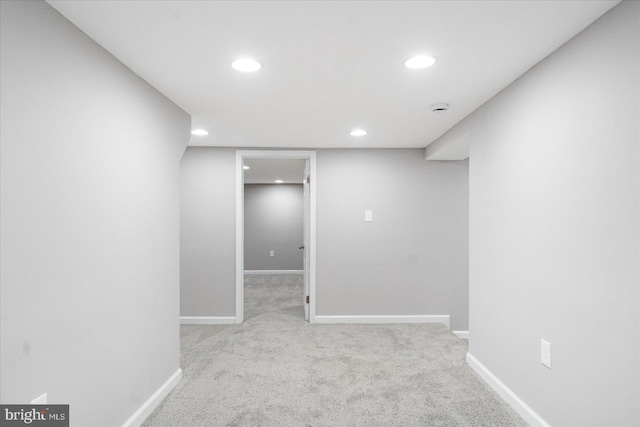 basement with light colored carpet