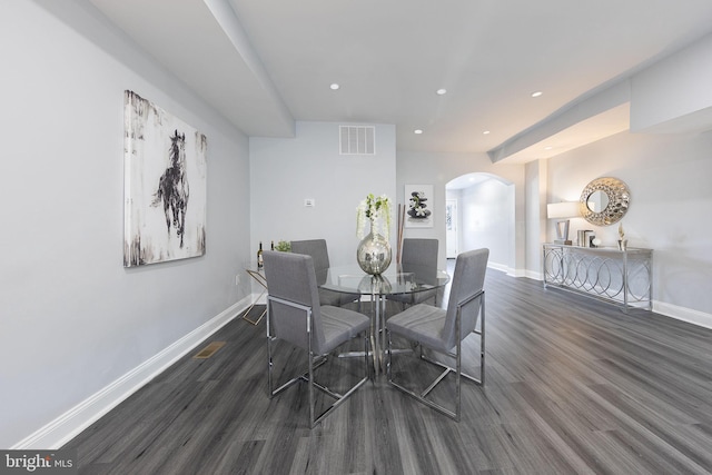 dining space featuring dark wood-type flooring