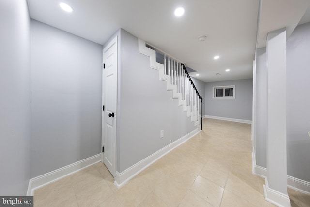 staircase featuring tile patterned flooring