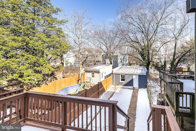 wooden terrace featuring a storage shed