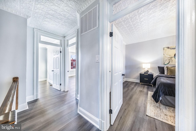 corridor featuring dark hardwood / wood-style floors