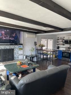 living room with dark wood-type flooring and beam ceiling