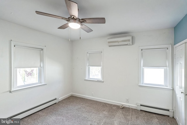 unfurnished room with a baseboard heating unit, a wall mounted AC, light colored carpet, and ceiling fan