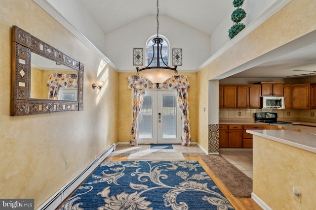 interior space featuring french doors, high vaulted ceiling, hanging light fixtures, a baseboard radiator, and stainless steel appliances