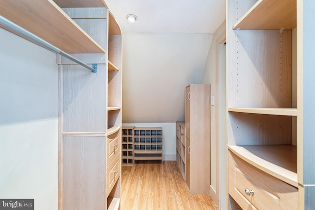 walk in closet featuring light hardwood / wood-style flooring