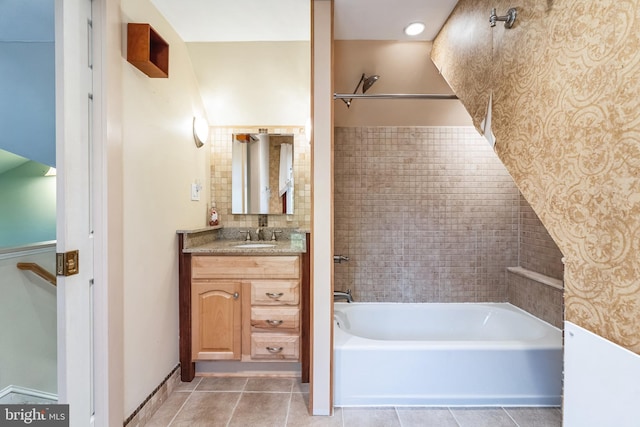 bathroom with tile patterned floors, bathtub / shower combination, and vanity