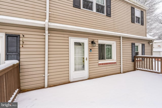 view of snow covered property entrance