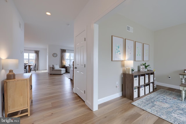 entryway featuring light wood-style flooring, visible vents, baseboards, and recessed lighting